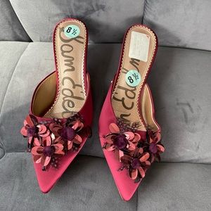 Red heels with red flowers on the top